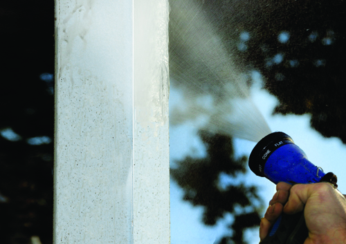 A simple spray of the garden hose is the best way to keep your vinyl fence looking fresh and new.